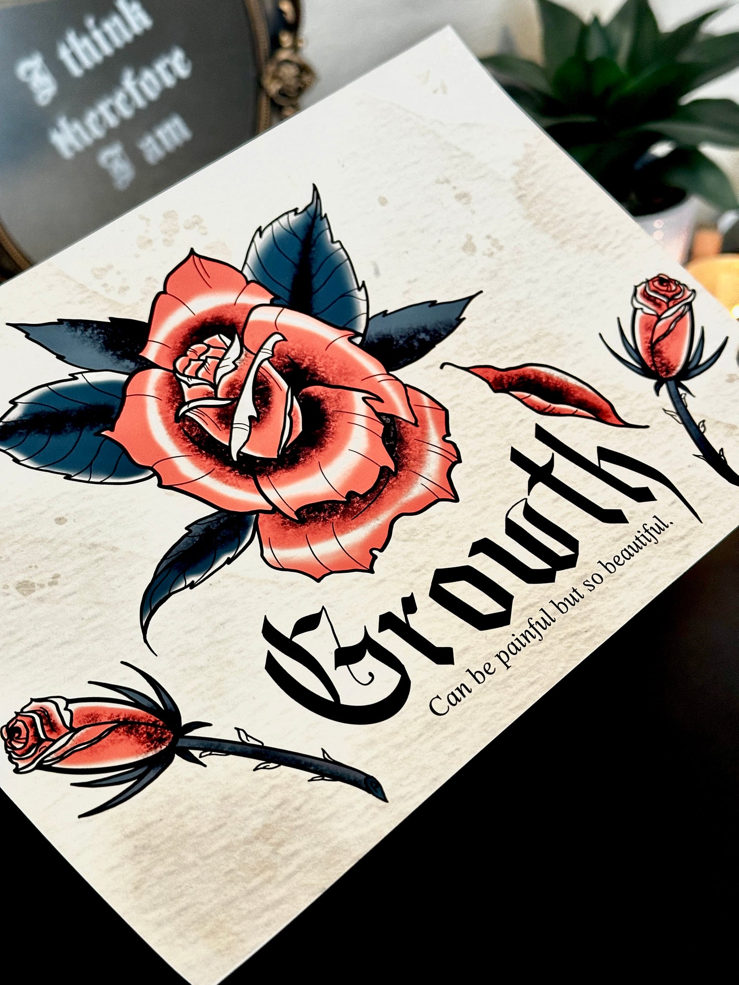 Art print with details of roses on a textured tan background with watermarks and pink and green coloring in flowers with gothic calligraphy word "growth" and following text "can be painful but so beautiful" by Rugged Attitude.