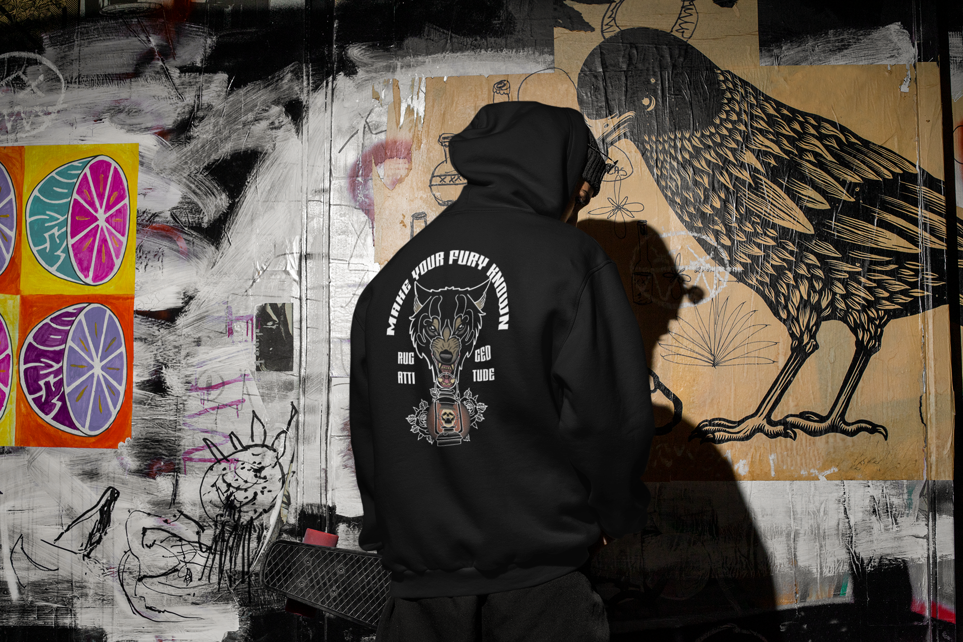 Man wearing hoodie showing off the back design of A Wolf's Fury